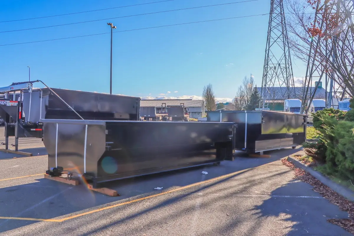 Roll-off dumpster ready for waste disposal at job site for Concrete Dumpster Rental in Inwood